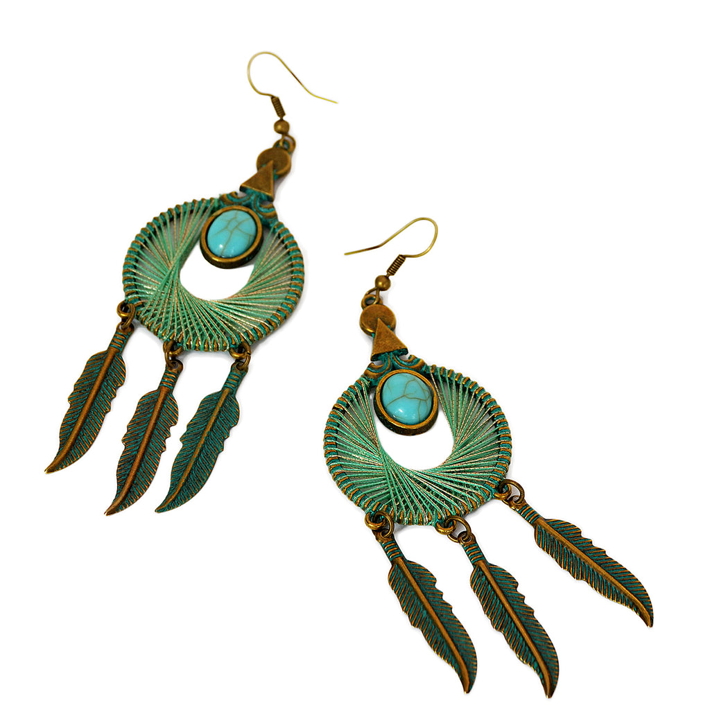 Tassel earrings with blue and gold wrapped strings on hoop, turquoise bead and hanging feathers