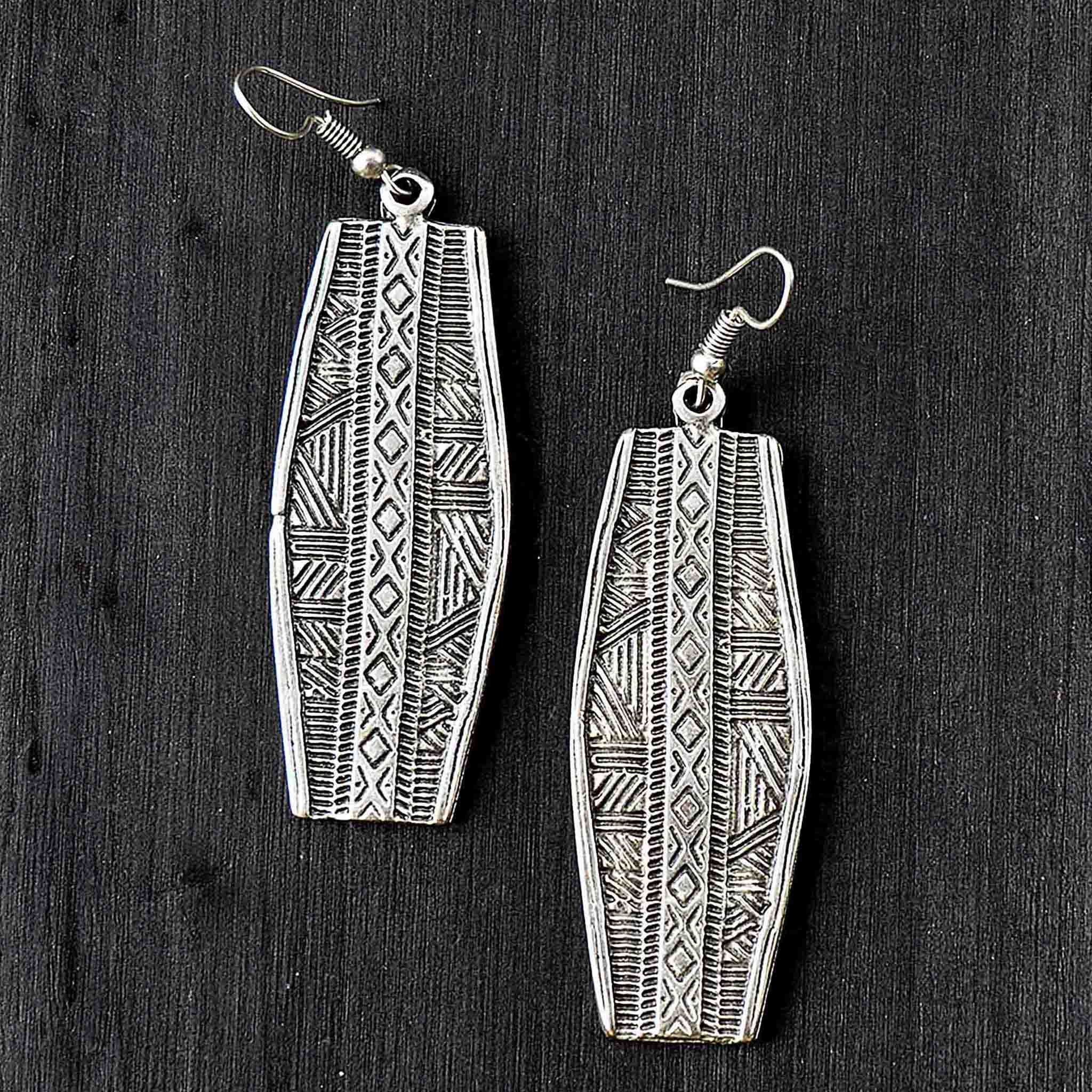 Long tribal earrings with engraved geometric motifs