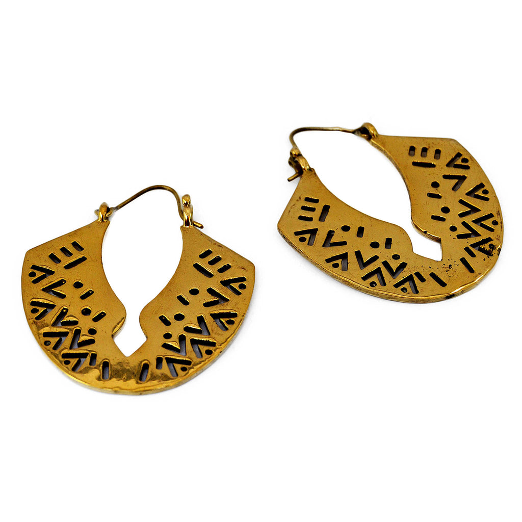 Large african carved hoop earrings on white background
