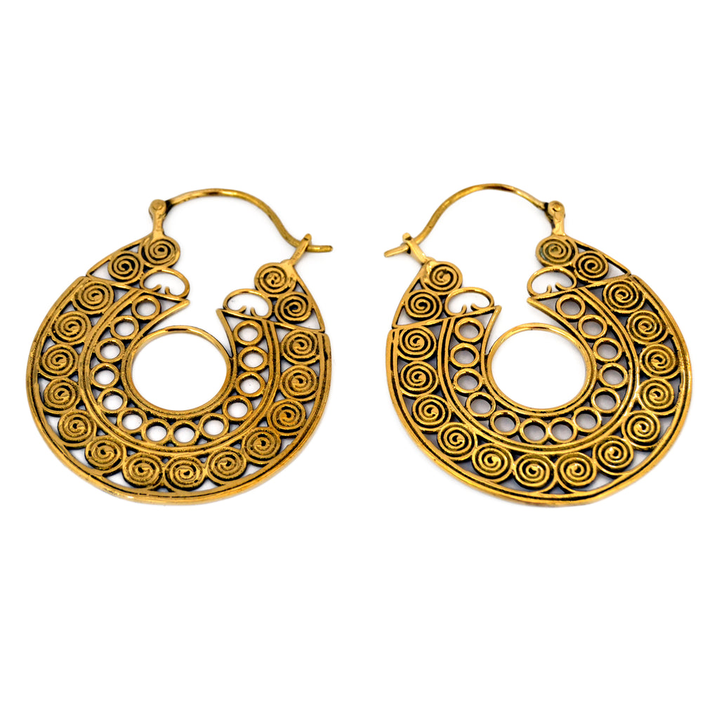 Brass indian filigree hoop earrings on white background