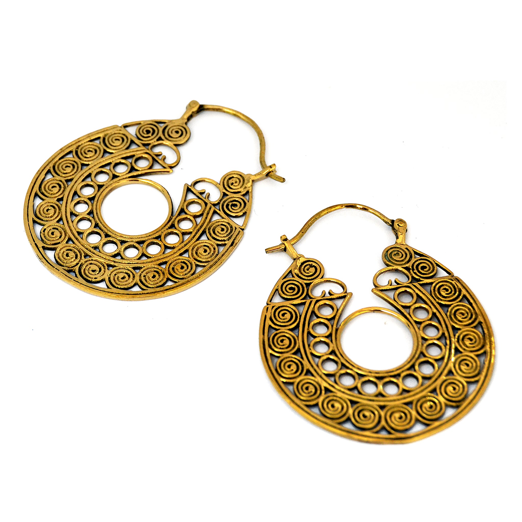 Brass tribal filigree hoop earrings on white background