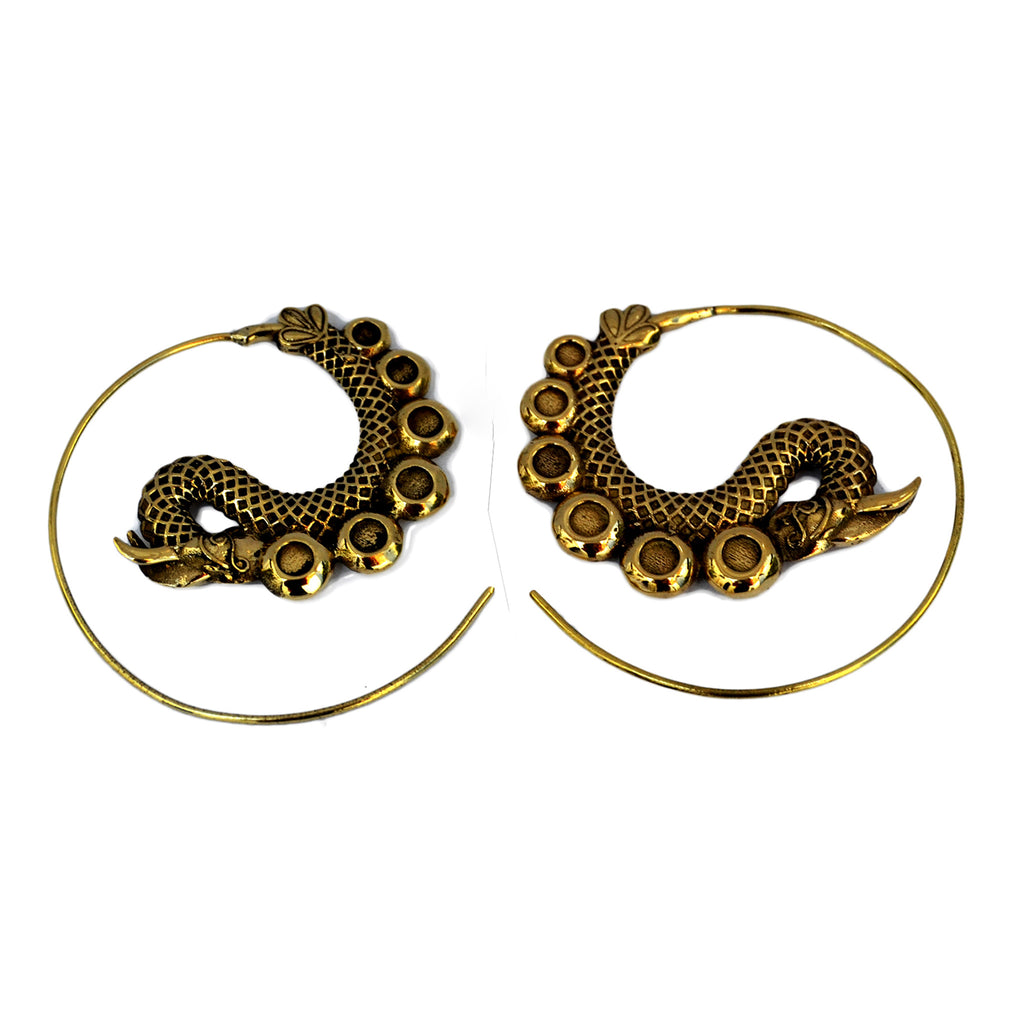 Gold dragon spiral earrings on white background
