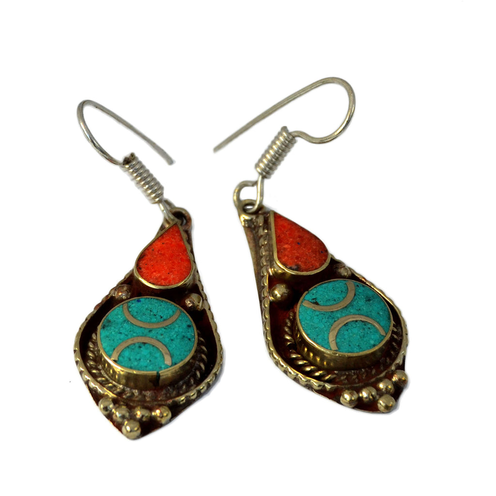 Delicate tibetan drop earrings with inlay turquoise and red coral stones on white background