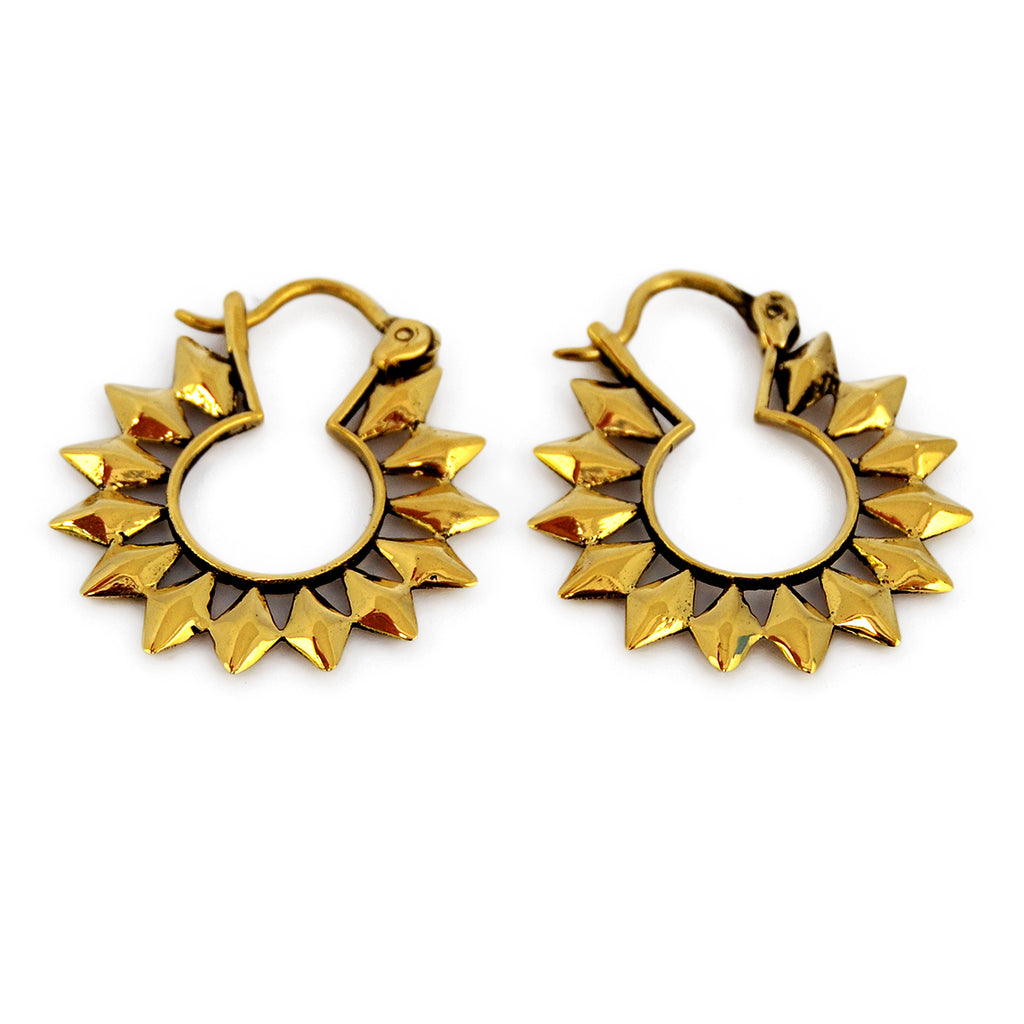 Small brass sun hoop earrings on white background