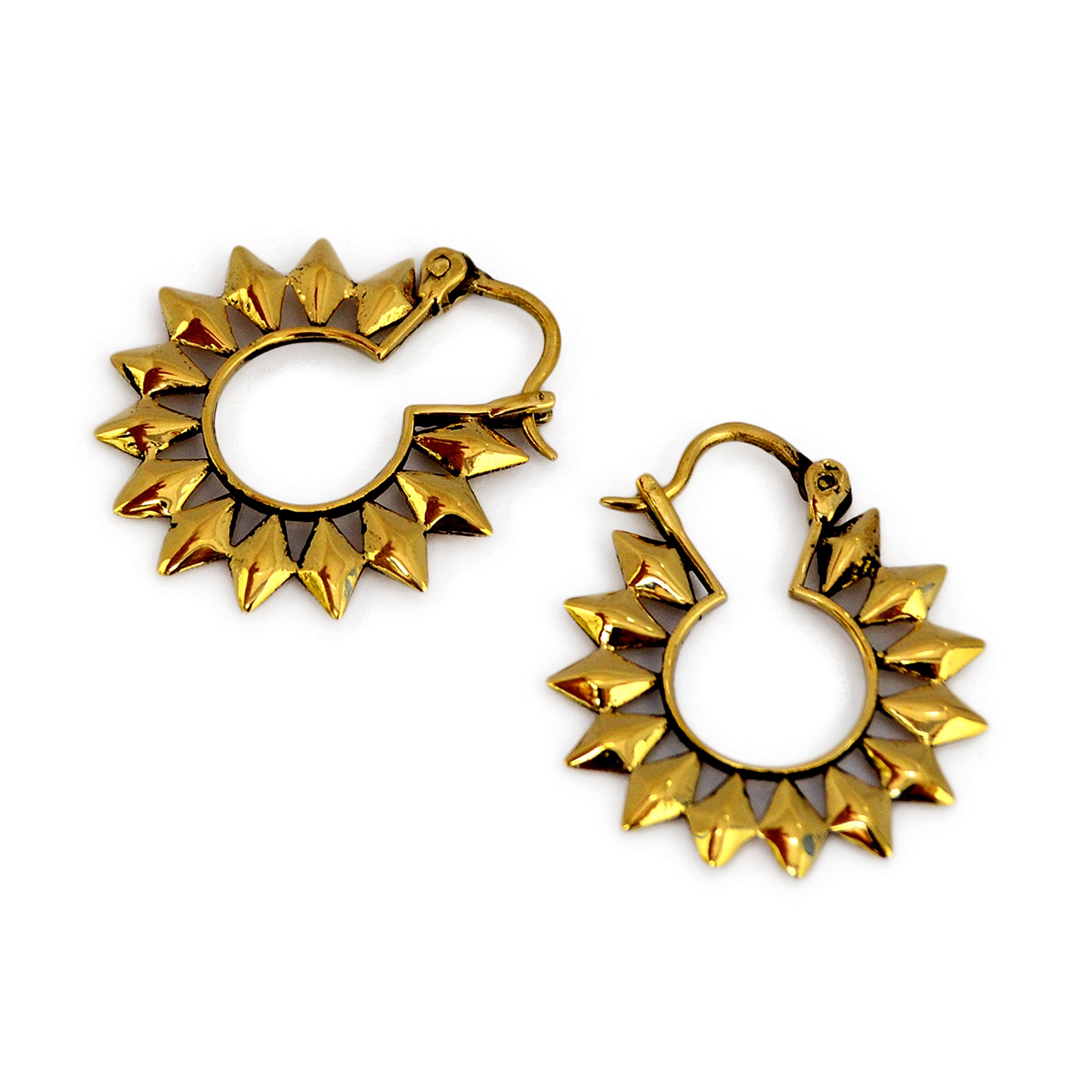 Small golden sun hoop earrings on white background
