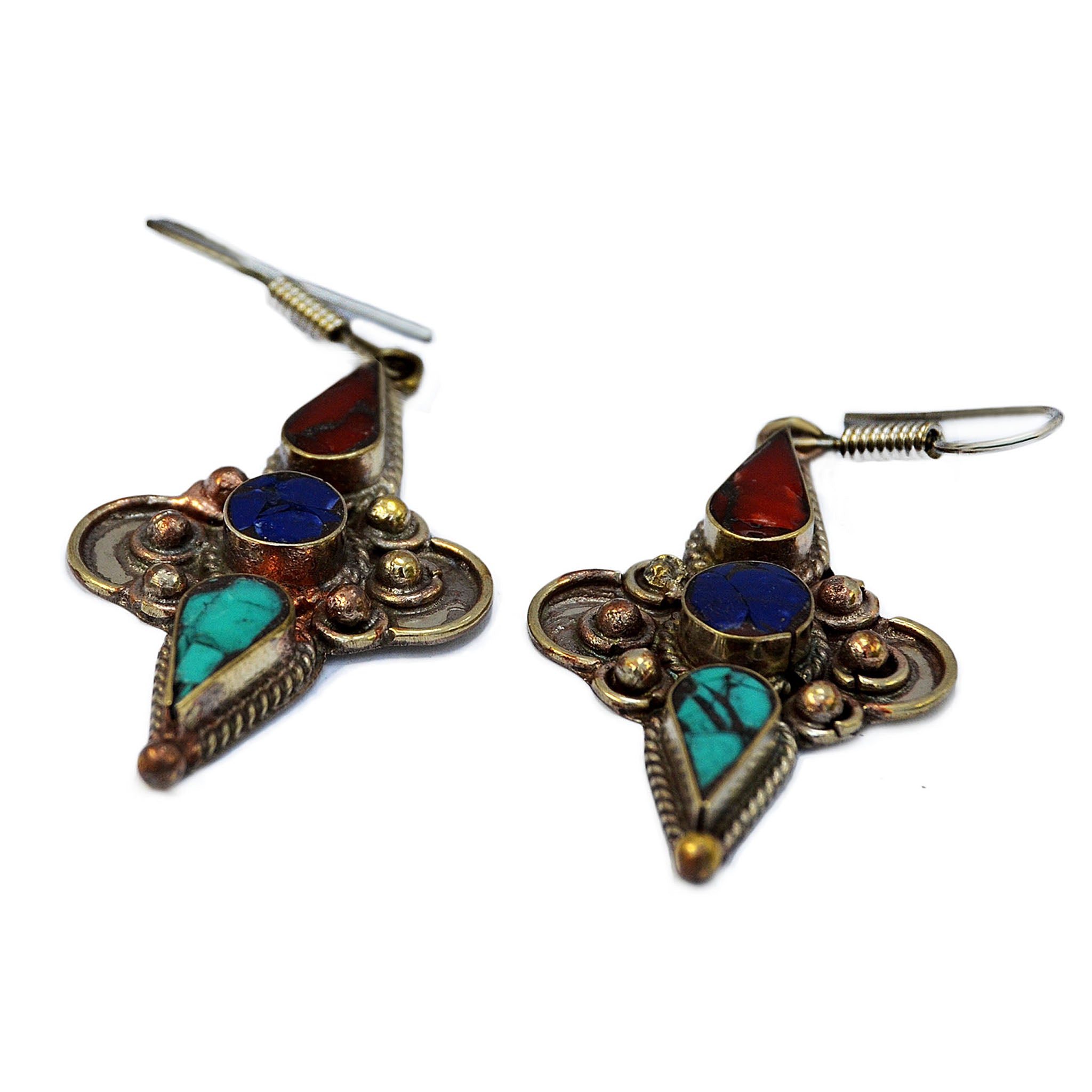 Silver tibetan hanging earrings with inlay turquoise, lapis lazuli and red coral stones on white 