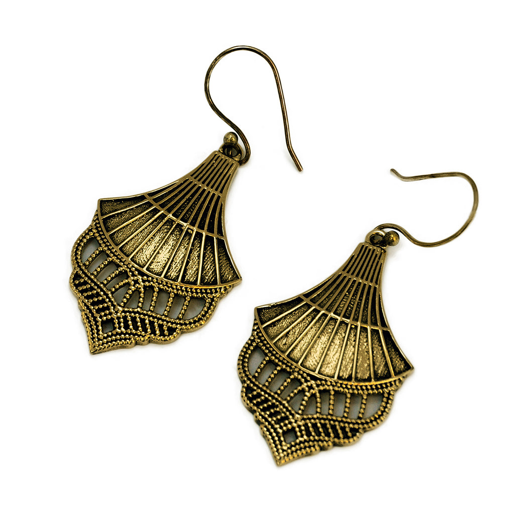 Golden vintage drop filigree earrings on white background