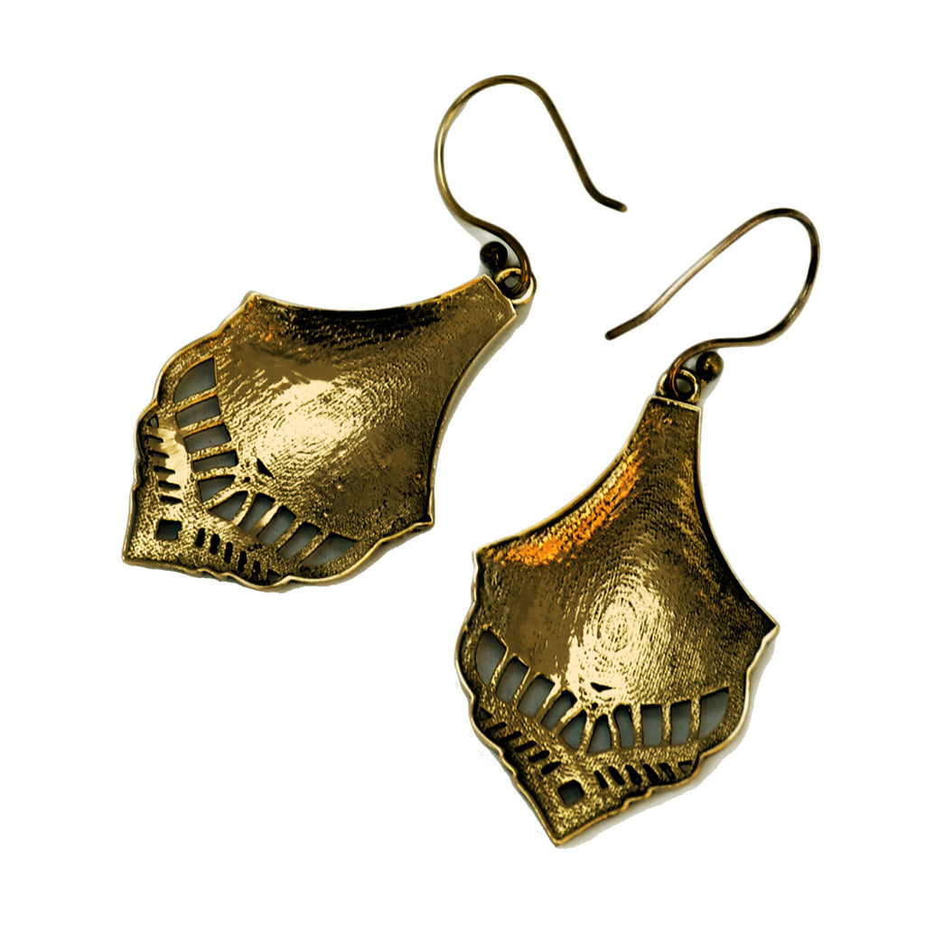 Reverse of gold vintage drop earrings on white background