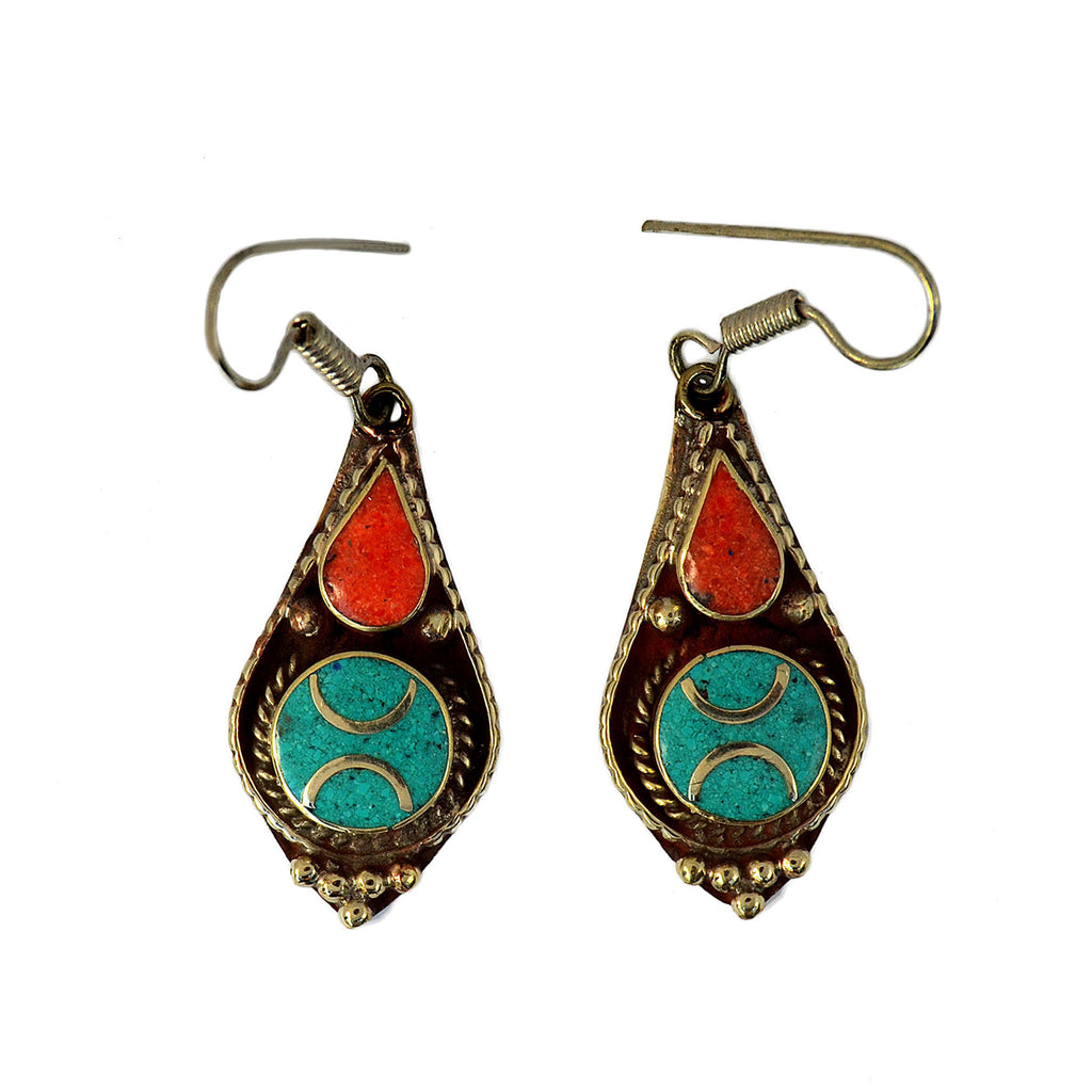 Tibetan drop earrings with inlay turquoise and red coral stones on white background