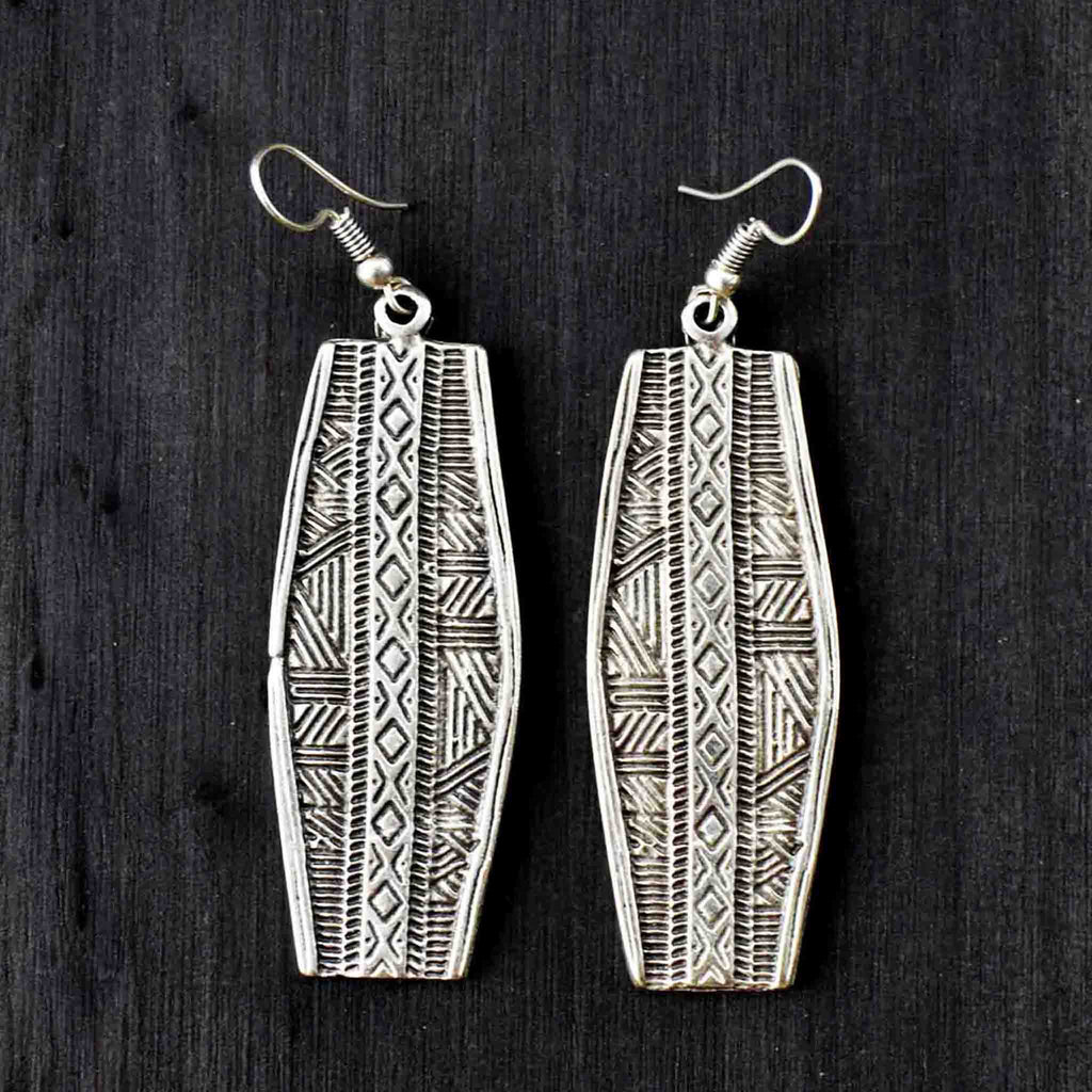 Dangly silver earrings with engraved geometric motifs