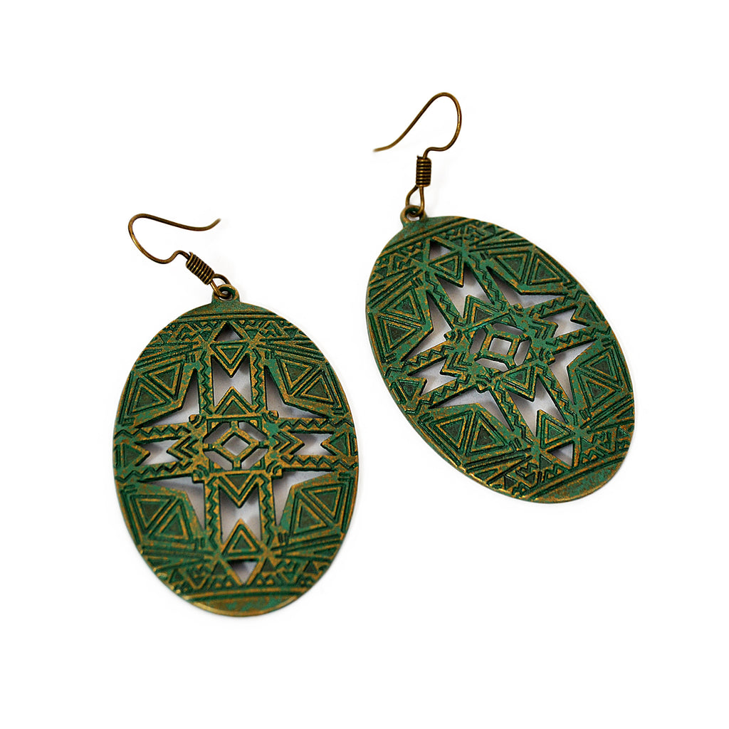 Oval earrings with aged turquoise green patina and geometric carved design