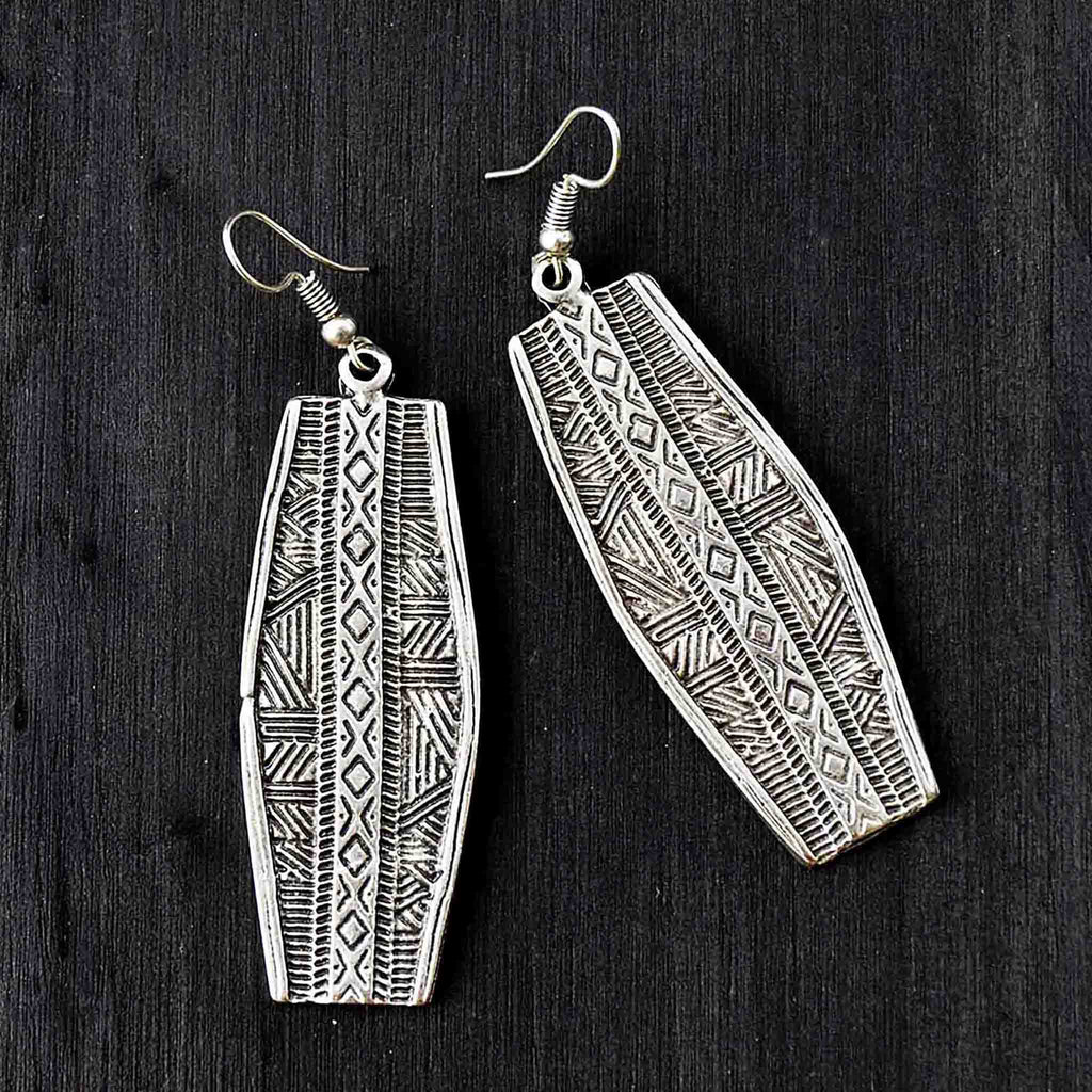 Long silver earrings with engraved geometric motifs