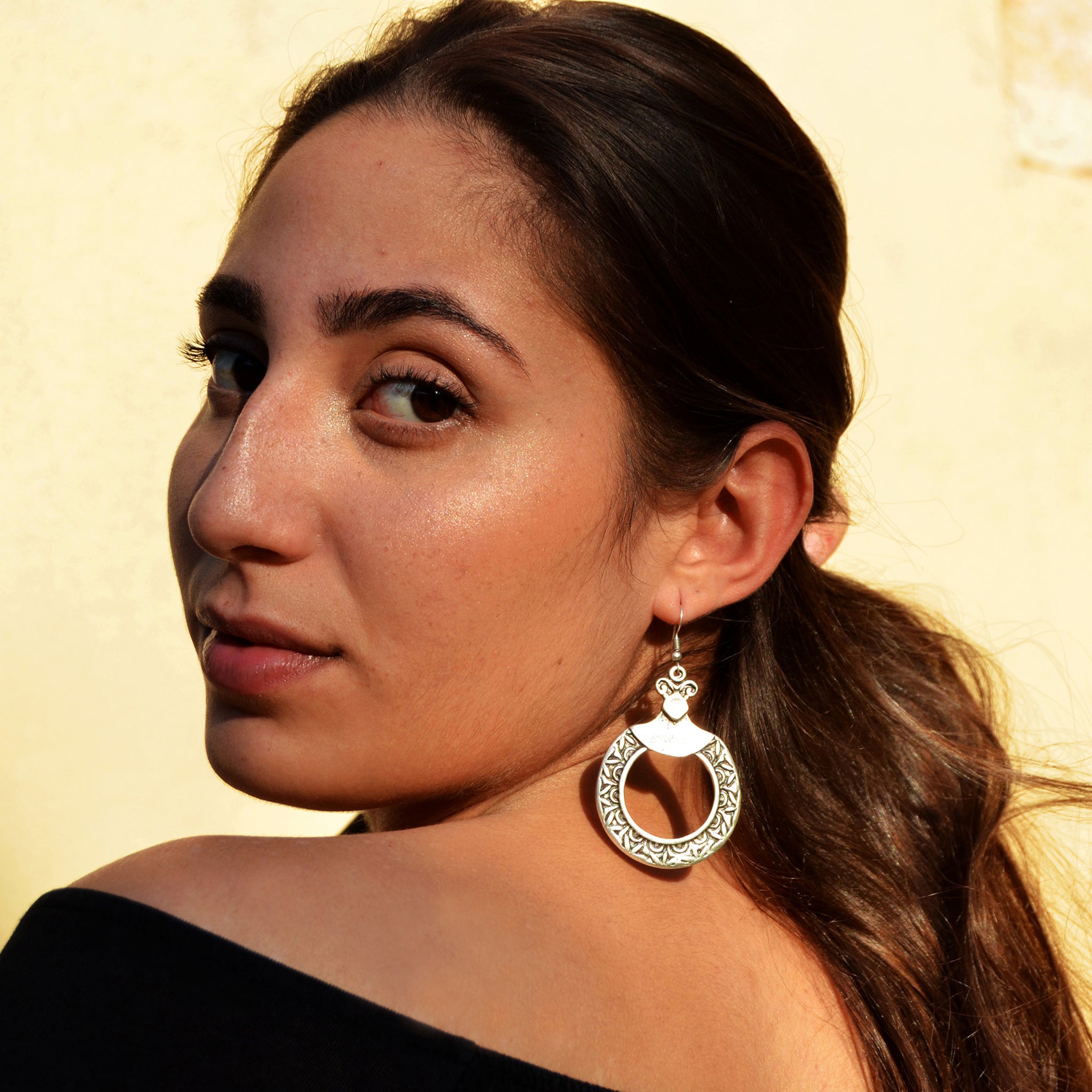 Young woman with tribal hoop earrings